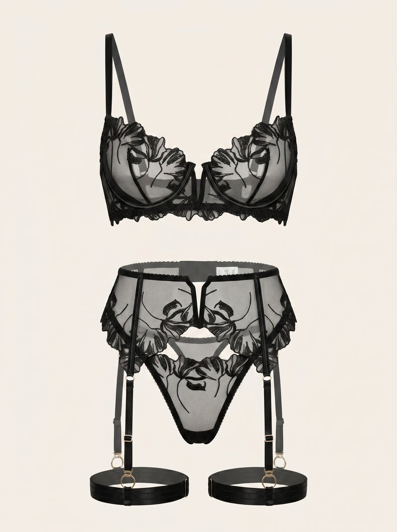 Set di lingerie in rete nera con ricami floreali