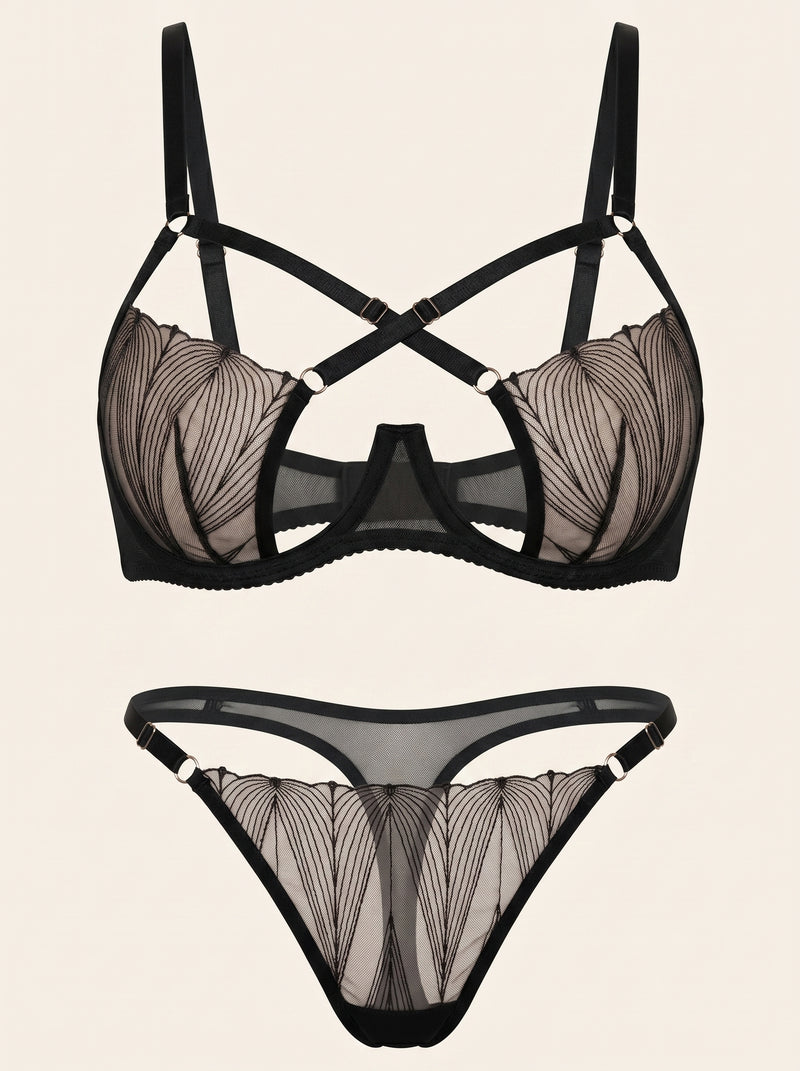 Set di lingerie in rete nera con aperture a strisce