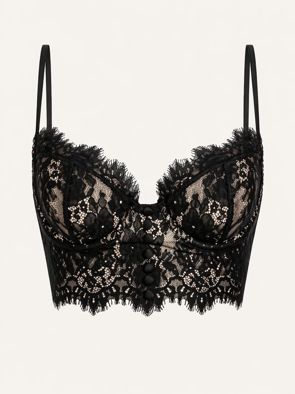 Reggiseno in pizzo nero con dettaglio di bottoni e design trasparente con spalline