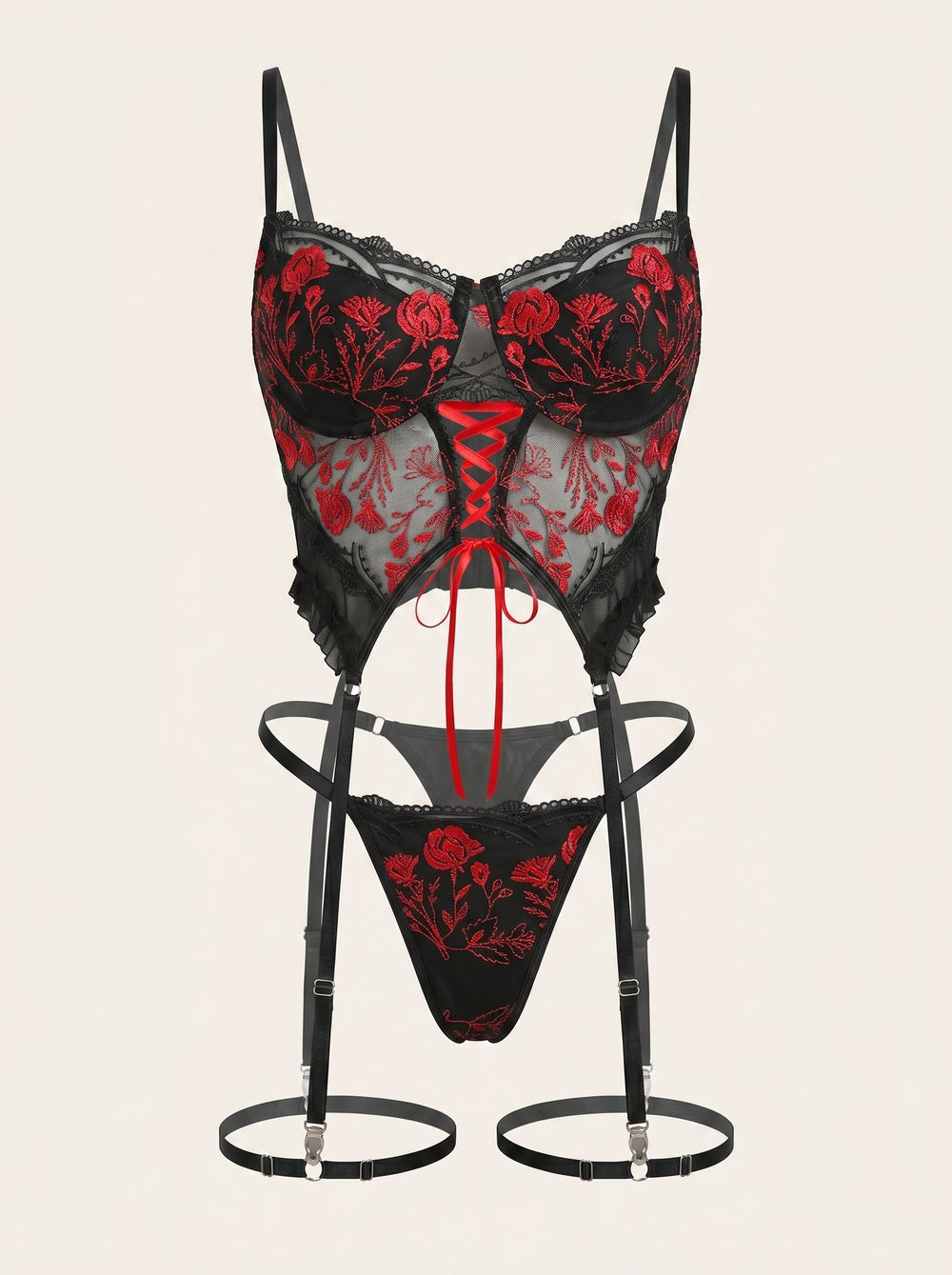 Completo intimo in rete rossa con ricami floreali e design con aperture e spalline intrecciate