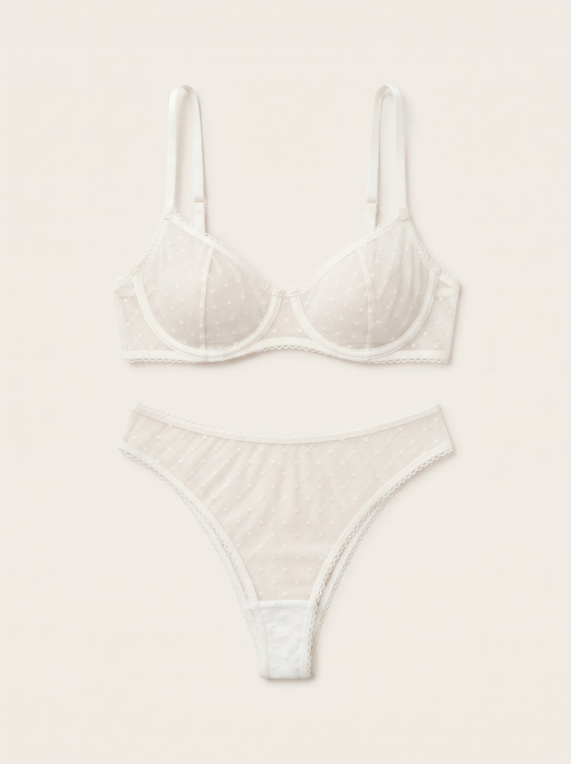 Set di lingerie in tulle bianco con dettagli trasparenti con strappy